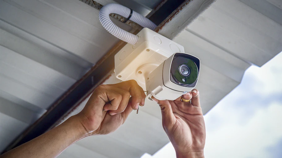 Person-installing-security-camera